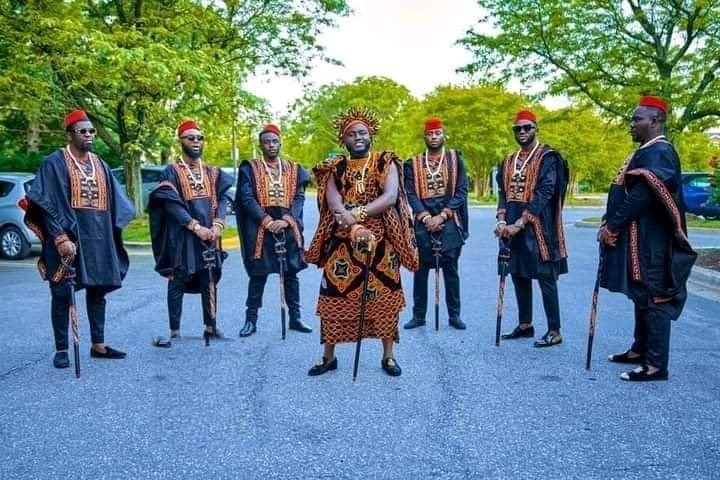 Groom in a Toghu outfit outdoors